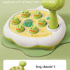 A small green frog toy set with multiple frog figures and a hammer for a toddler matching game.