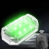 A clear plastic strobe light unit with a green LED glow and a wireless receiver module.