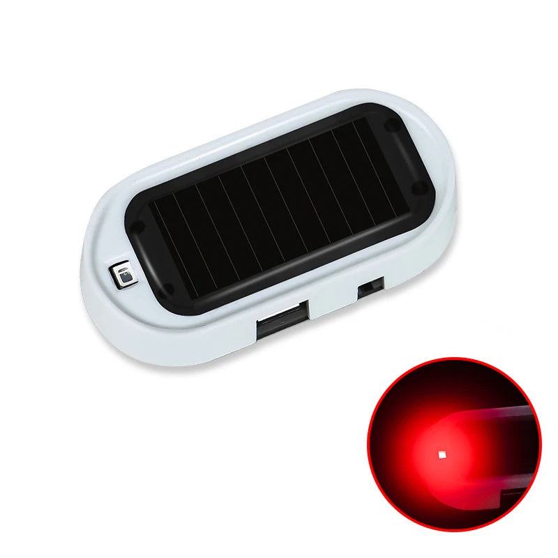 Luz de seguridad falsa blanca con panel solar negro y lente LED de alarma.