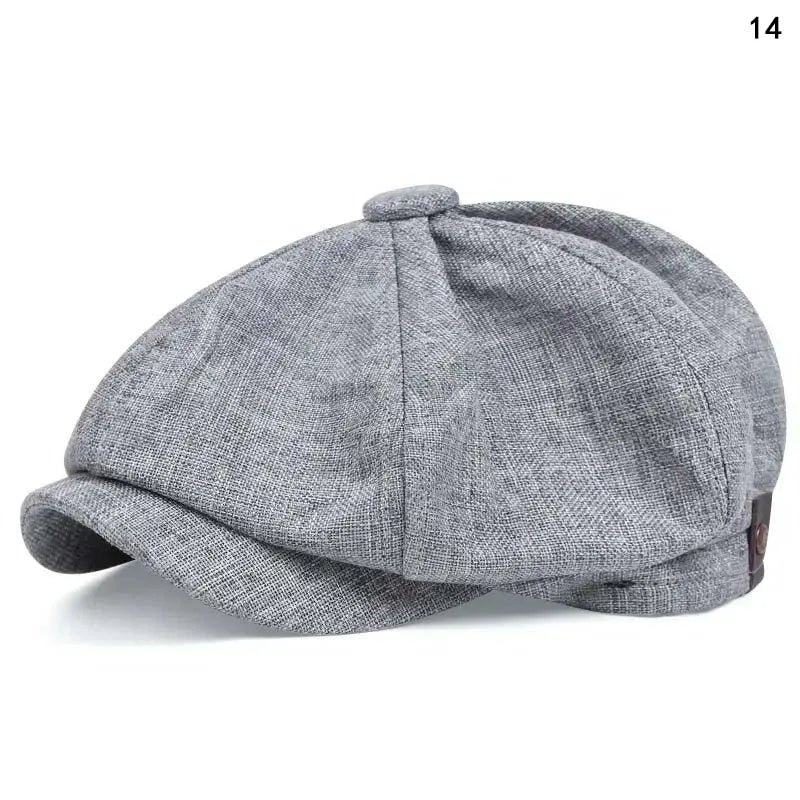 A grey vintage retro newsboy cap with a folded brim shown from above.