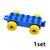 A blue building block set featuring traffic vehicles and a train, including yellow wheels and blue blocks.