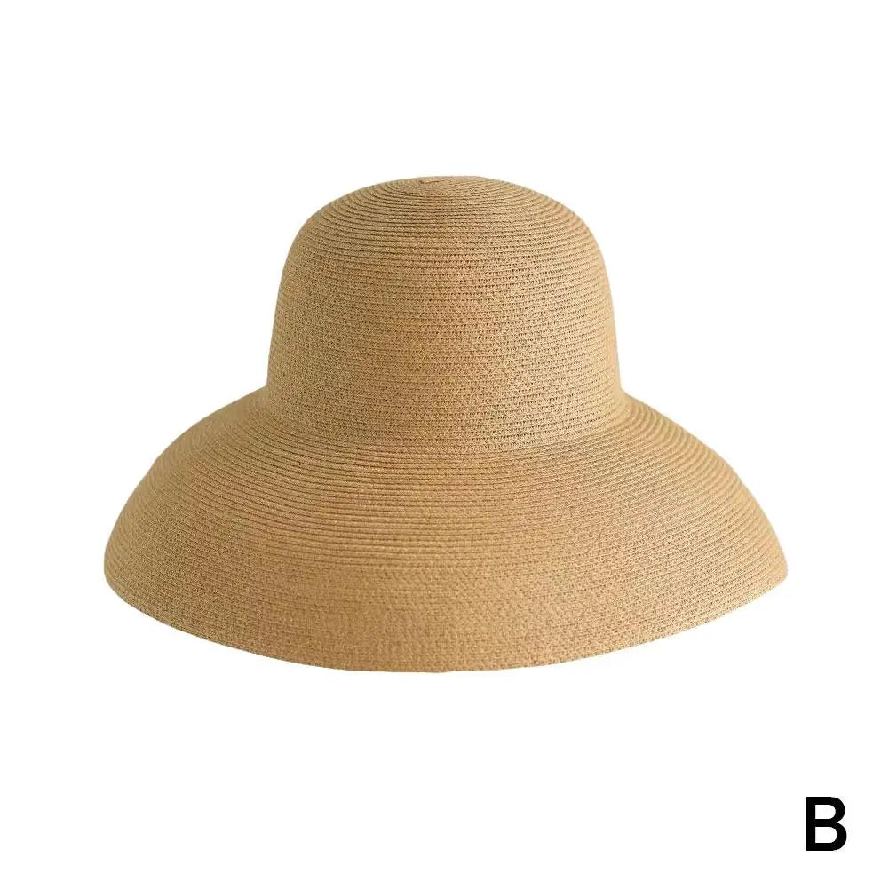A beige wide brim straw sun hat for women.
