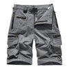 Gray men's cotton cargo shorts featuring multiple pockets and a flap closure