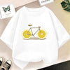 White kids t-shirt featuring a graphic design of a bicycle with lemon wheels