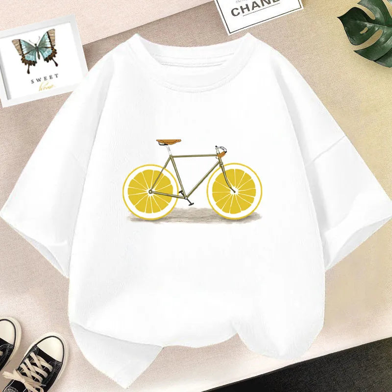 White kids t-shirt featuring a graphic design of a bicycle with lemon wheels