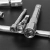 Close-up photo of chrome steel socket extension bars with various drive sizes resting on a dark surface.