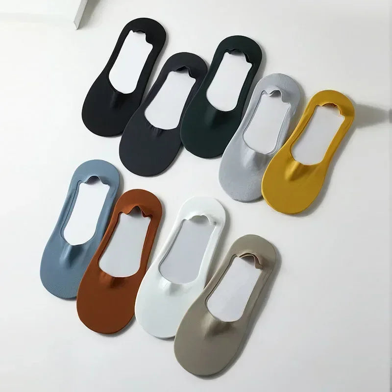 A collection of five men's no-show socks with silicone grips in various colors including black, gray, olive green, and brown.