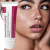A tube of brightening cream with a white cap and pink label is shown next to a woman's face.