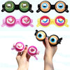 A collection of novelty funny glasses in various colors and designs, including pink, yellow, and black frames.