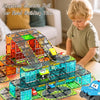 A young boy is playing with a magnetic electric rail car building tile set featuring an electric sliding car on a track.