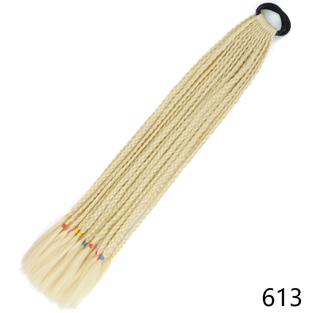 A long, light blonde pre-braided ponytail extension with colored tips and an elastic band.