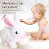 A baby is interacting with a white plush bunny toy designed to move back and forth for children's growth journey.