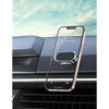 A pink smartphone is mounted on a black car dashboard using a magnetic rotating phone mount.