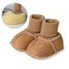 A pair of tan suede leather winter booties with a ribbed cuff and a soft fur lining, shown next to a close-up of the fluffy l