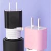 A black silicone charger protector and cable organizer with white cables and pink housing.