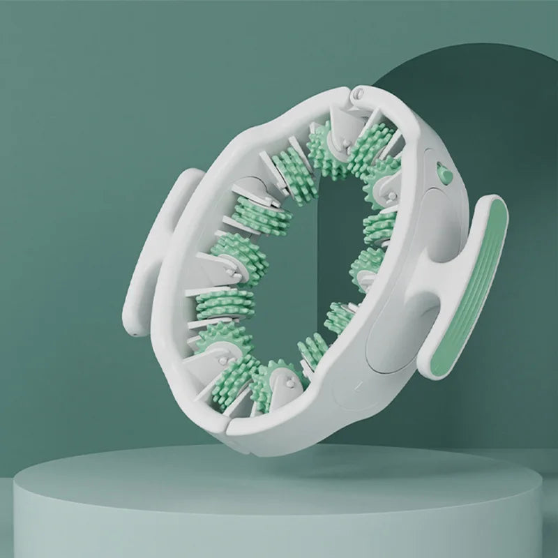 A white full body massage roller with green bristles and detachable handles is shown against a teal background.