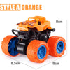 An orange pull-back stunt SUV toy car with black and orange details shown from the side.