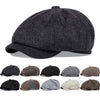 A collection of vintage retro newsboy caps in various shades of gray and brown.