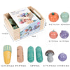 A wooden pretend play food cutting set for kids showing various vegetable shapes and sizes.