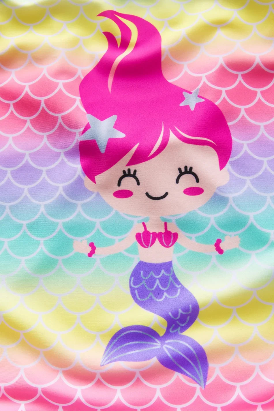 A pink mermaid unicorn swimsuit design featuring a smiling face and purple tail on a colorful scale background.
