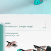 A close-up view of a teal airplane launcher toy with three foam planes for outdoor play.