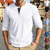 A man models a white long-sleeve casual shirt with a chest pocket and collar against an urban background.