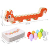 An orange magnetic caterpillar puzzle toy for kids with various colored pieces and a matching card.