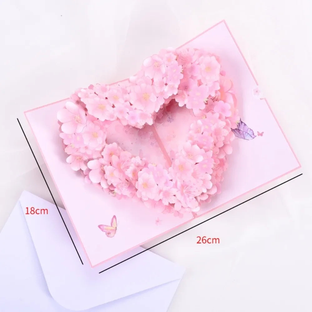 Pink floral heart wreath card with a couple silhouette design