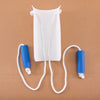 White sock aid with blue straps and white cord lying on a brown surface.