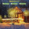Solar powered LED fireworks garden lights illuminating a wooden fence in a snowy outdoor setting