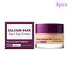 A dark purple jar of Calcium Dark Spot Eye Cream with a light pink product and packaging.