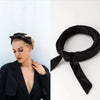 Black velvet heatless curling rod headband tied in a bow for overnight waves