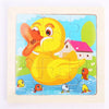 A jigsaw puzzle featuring a yellow cartoon duckling and a pink house in a blue landscape.