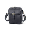 A dark navy vegan leather messenger bag with a gold-toned buckle and adjustable strap.