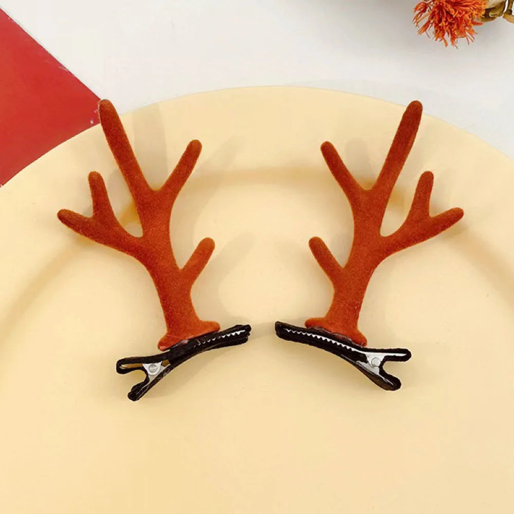 Par de clips para el pelo en forma de astas de reno marrón con agarres negros