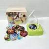 A green interactive card story phonograph with a white horn is displayed next to its packaging box.