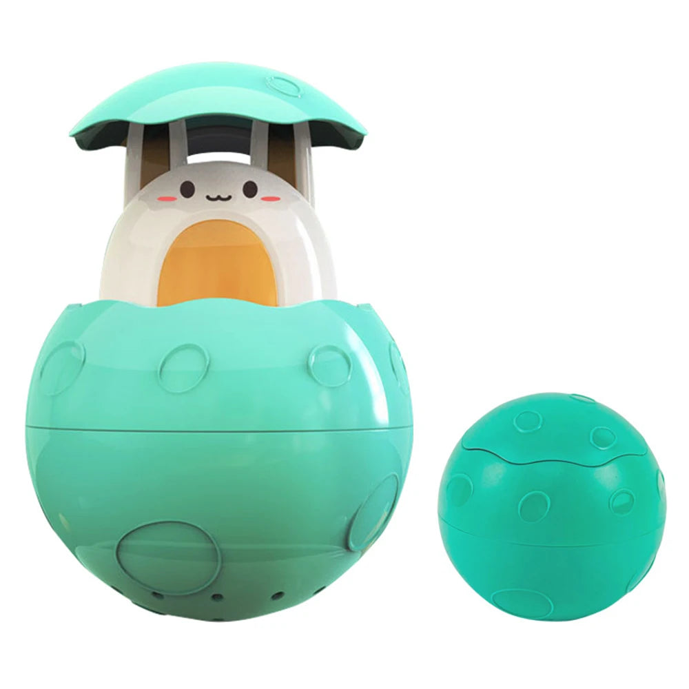 A teal bath toy featuring a duck and penguin design with water spray features.