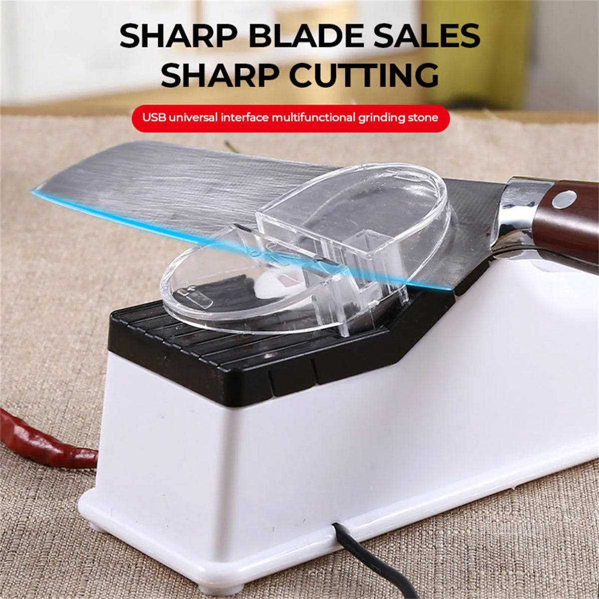 A white electric knife sharpener with a metal blade and clear protective cover is shown on a light brown surface.