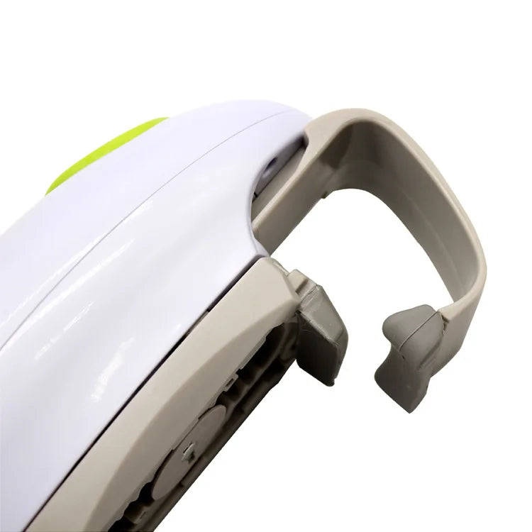 A close-up view of a white and beige automatic electric can and jar opener device.