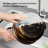 Hands are cleaning a double-sided concave friction cleaner pan under a kitchen faucet.