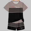 A light gray t-shirt and matching black and gray striped shorts set displayed on a hanger.