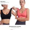 A woman models a black sports bra and a coral-pink sports bra, highlighting non-trace integration design.