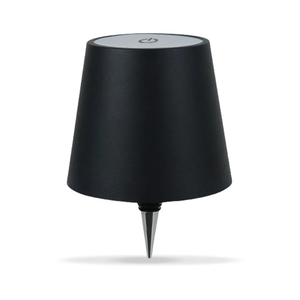 A black LED table lamp with a conical shade and a silver touch control button.