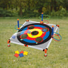 Portable cornhole toss game set with six bean bags and scoring rings on a gray board in a grassy field.