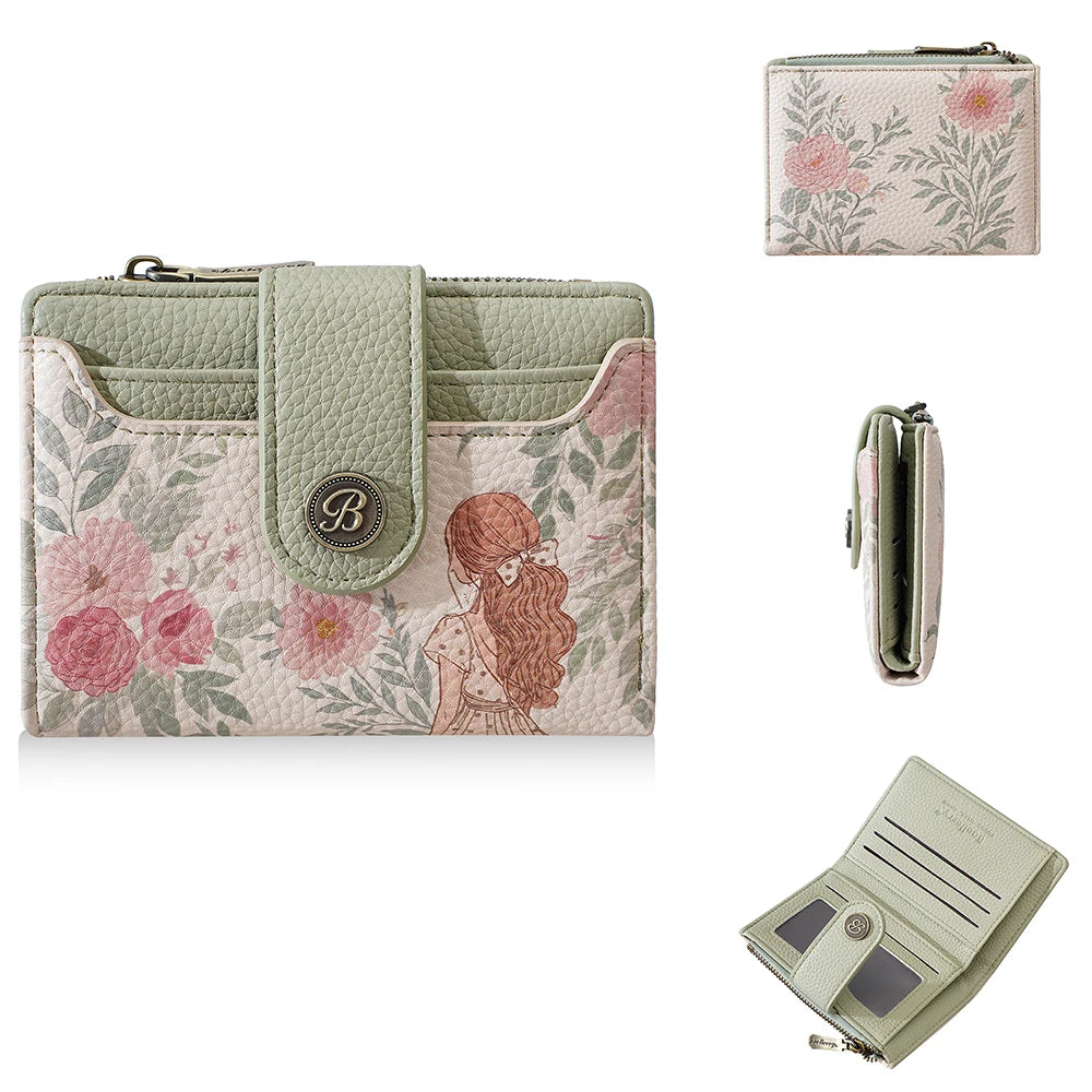 A light pink floral print women's wallet with a green leather cover and zipper.