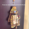 Handcrafted kitchen witch doll with antique charm featuring a brown and gold outfit and long hair