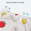 White potty training pants with fruit and letter designs shown on a close-up.