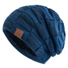 A dark blue knit beanie with a textured pattern shown from the side.
