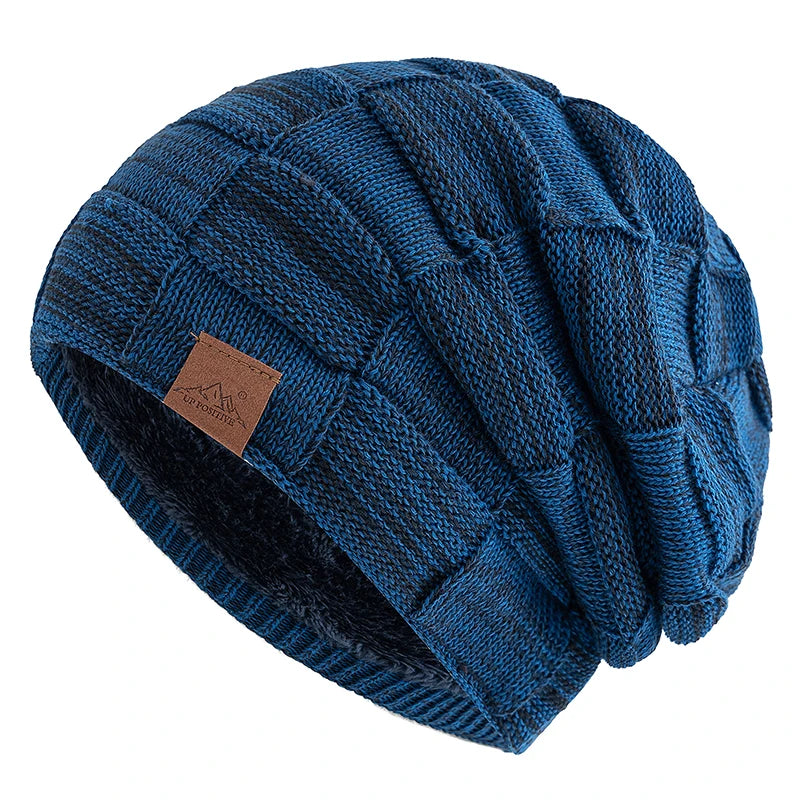 A dark blue knit beanie with a textured pattern shown from the side.