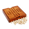 A wooden peg solitaire game box with a grid of holes and loose wooden pegs.